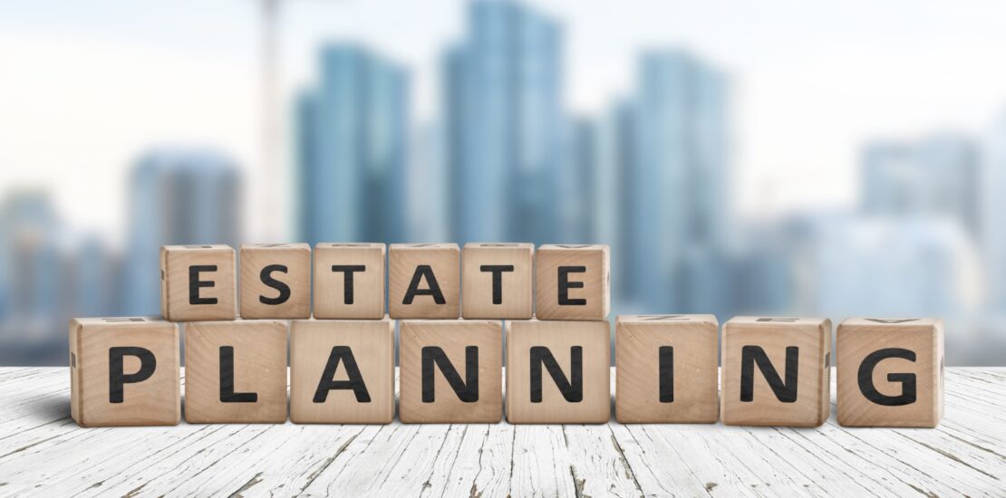 Estate planning sign on a wooden pier with tall buildings in the background